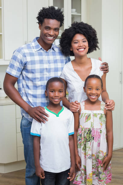istock Happy family smiling at camera 813996328