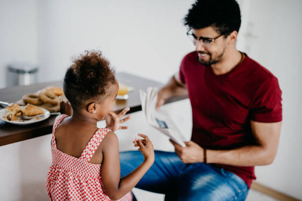 istock Happy father and daughter are having fun during breakfast 813999666