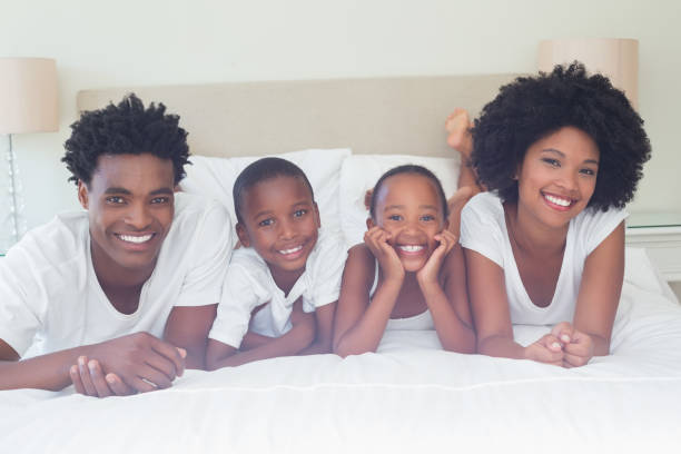 istock Happy family smiling at camera 814007092