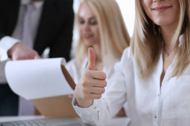 istock Beautiful smiling woman showing OK or approval sign 814007788
