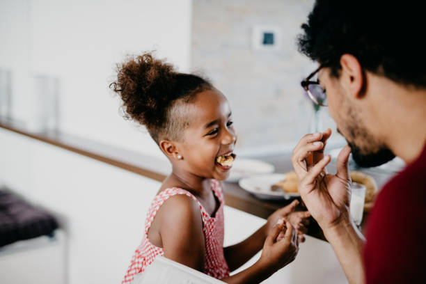 istock Pretty african kid is laughing with her mouth full 814007890