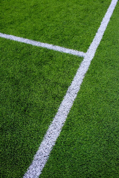 istock The white Line marking on the artificial green grass soccer field 814010674