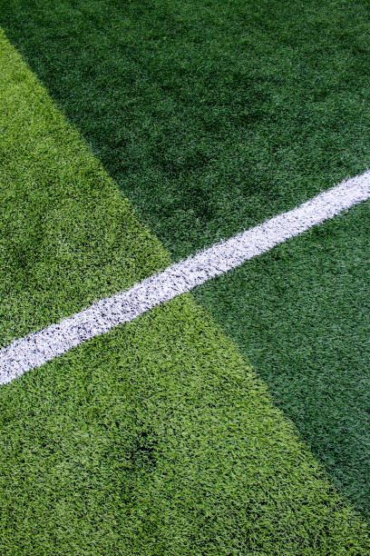 istock The white Line marking on the artificial green grass soccer field 814010826