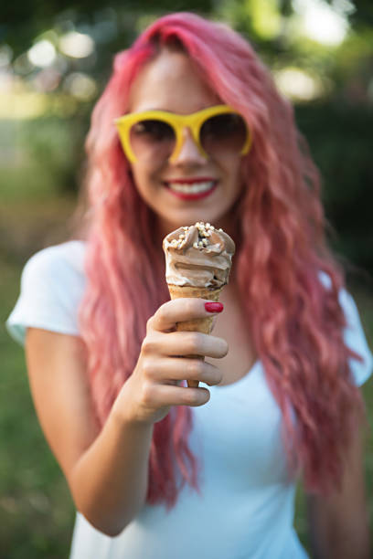 istock Woman holding ice cream 814016108