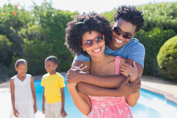 istock Happy parents smiling at camera 814033998