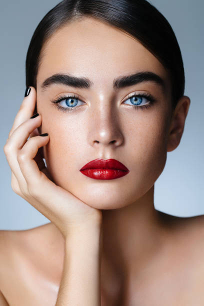 istock Beautiful woman with red lips 814038698