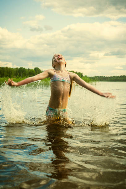 istock Girl in the lake 814041710