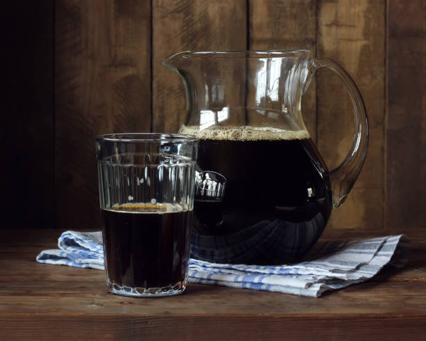 istock Beer or kvass. A pitcher with a dark drink. 814050618