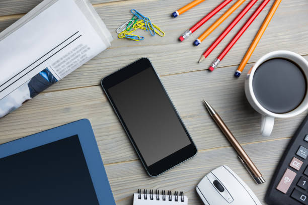 istock Smartpohne next to the cup of coffe newspaper tablet and computer 814050694