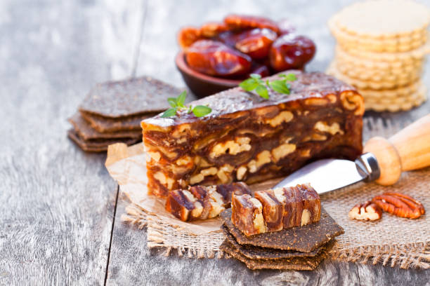istock Date  walnut wedge with multigrain crackers on wooden table 814053142