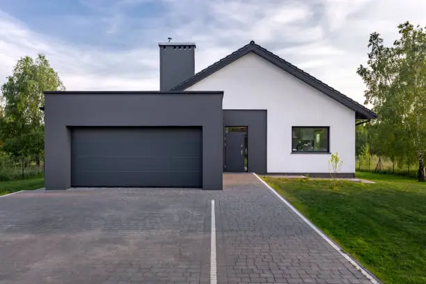 Cozy and modern house with garage and cobblestone driveway