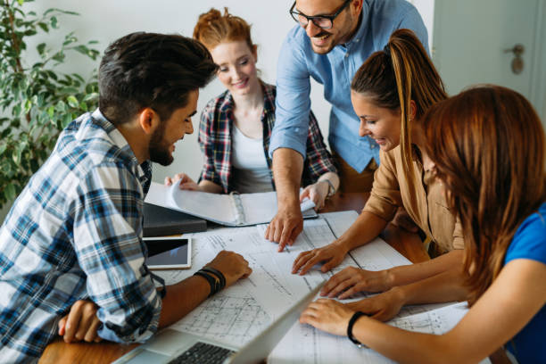 istock Image of business partners discussing documents and ideas 814093602