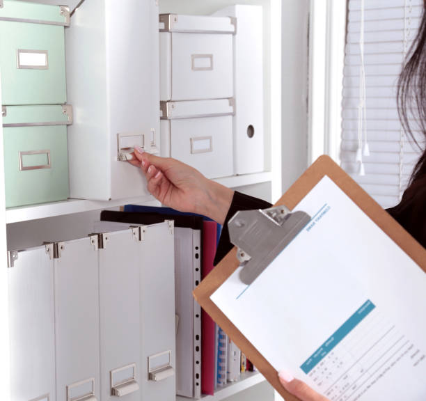 istock File folders, standing on shelves in the background 814106508