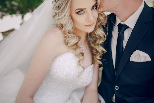 istock wedding couple hugs kisses 814110908