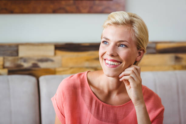istock Pretty blonde holding cup of coffee 814120780