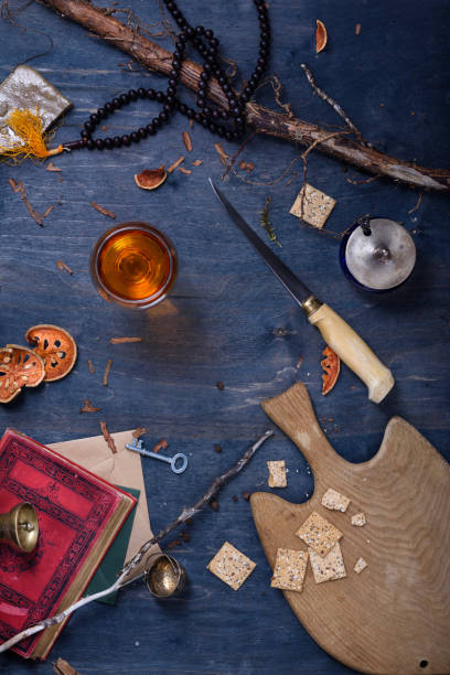 istock Kitchen table with fish cutting board and glass of wine. 814127794
