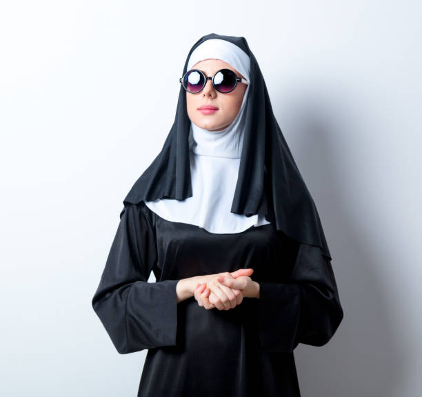 istock Young serious nun with sunglasses 814130620
