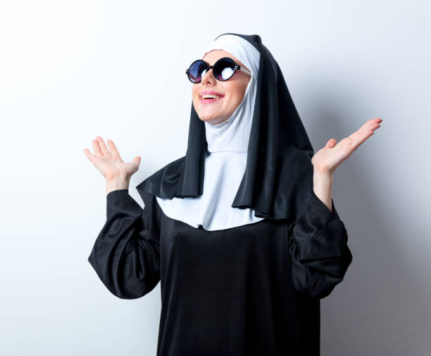 istock Young smiling nun with sunglasses 814130638