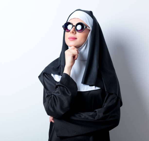 istock Young serious nun with sunglasses 814130648