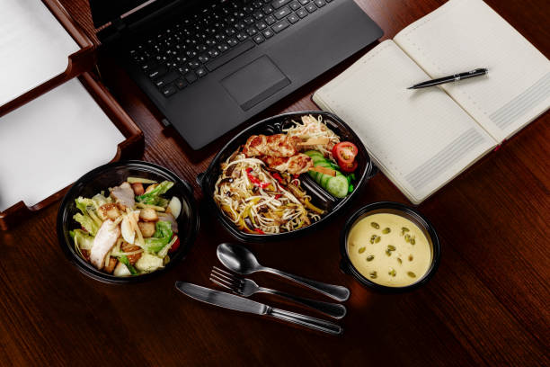istock Business lunch on the desktop of your computer 814135632