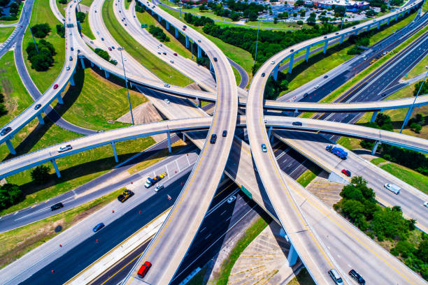 Aerial view looking down above Cross Over and Interchange Urban Sprawl Austin Texas Highway 183 and Mopac Expressway Interchange Aerial view looking down above Cross Over and Interchange Urban Sprawl overpass road stock pictures, royalty-free photos & images