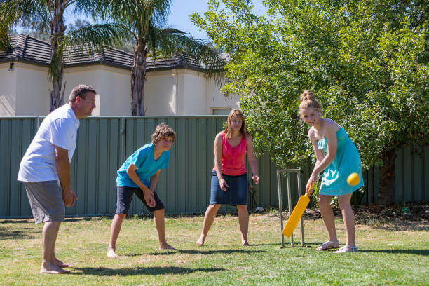 Family Playing Backyard Cricket