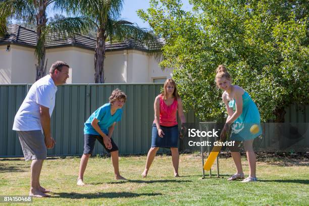 Family Playing Backyard Cricket Stock Photo - Download Image Now - Sport of Cricket, Cricket Player, Family