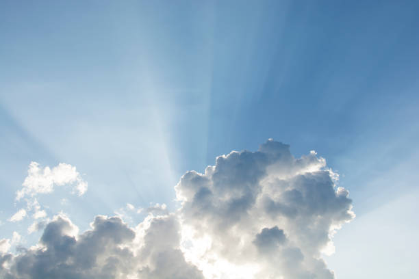istock Beautiful blue sky with sunbeams and clouds. Sun rays through the clouds like an explosion 814157992