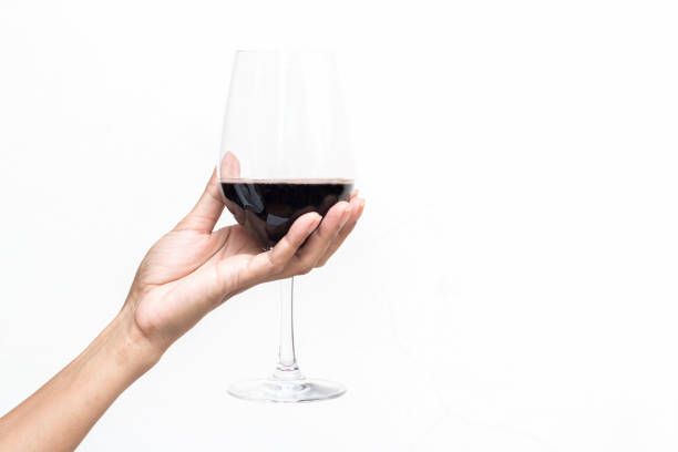 Hand holding a glass of wine stock photo