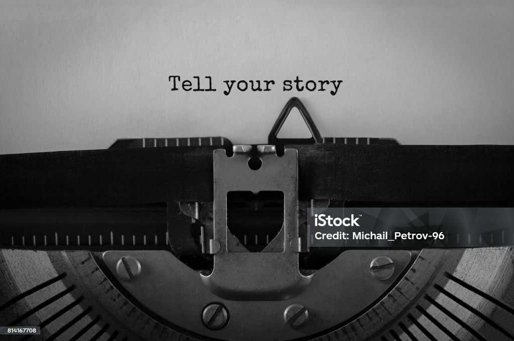 Text Tell Your Story typed on retro typewriter Advertisement Stock Photo