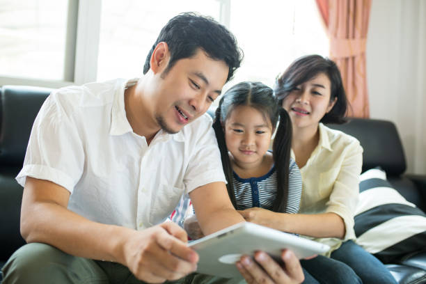 istock Asian family watch and use tablet 814170384
