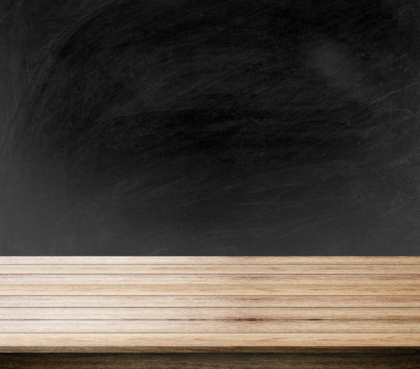 istock black background of blackboard, chalkboard and free space for you and desk space, can be used for display your products. 814170708