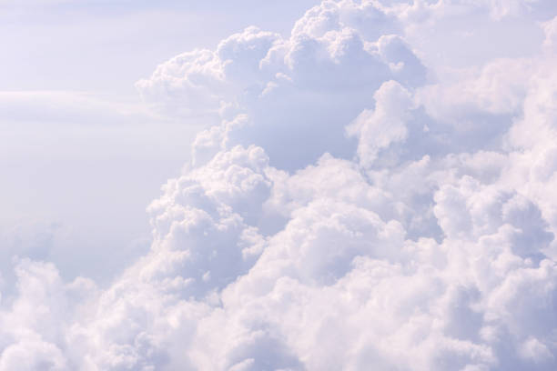 istock Blue sky and Clouds as seen through window of aircraft 814175916