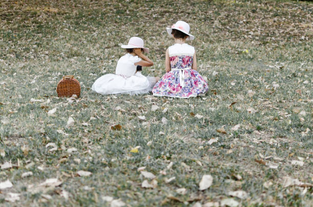 istock little princess sitting on the grass 814176216