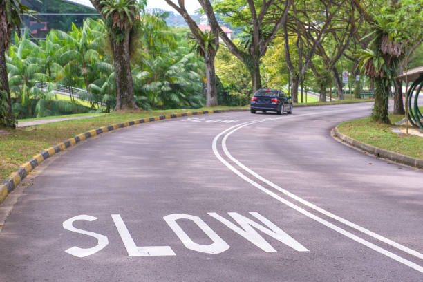 istock warning signs to slow down on a curving road 814186522