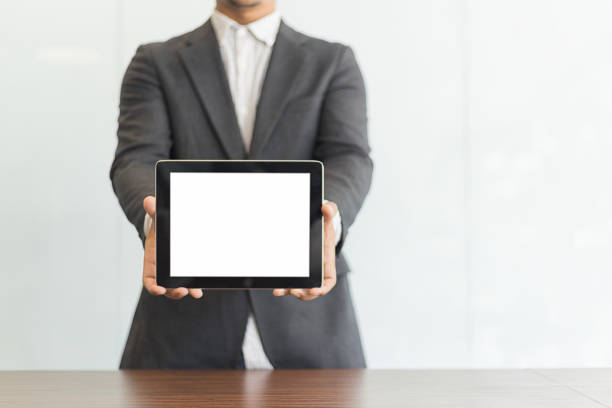 istock Businessman using his tablet in the office, business concept 814198564