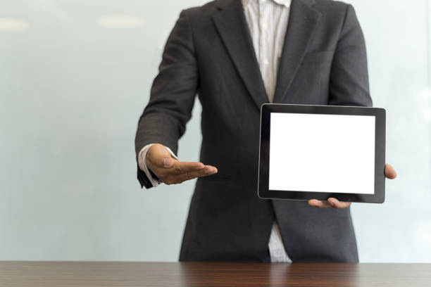 istock Businessman using his tablet in the office, business concept 814198580