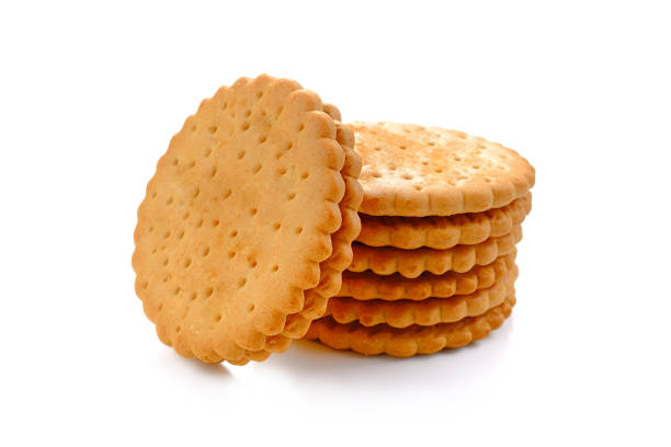 istock BISCUITS - A stack of delicious wheat round biscuits with a few crumbs isolated on white 814215778