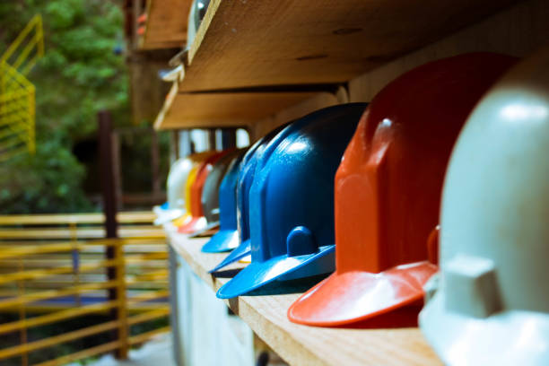 Helmets Colored helmets at an old gold mine. Ouro Preto, Brazil, May 2017. capacete stock pictures, royalty-free photos & images