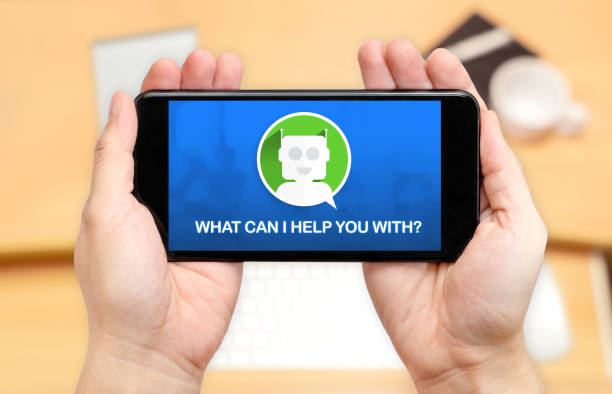 istock Watching two hand holding mobile phone with Chat bot and what can i help you with? with blur desk office background,Digital marketing concept 814236562