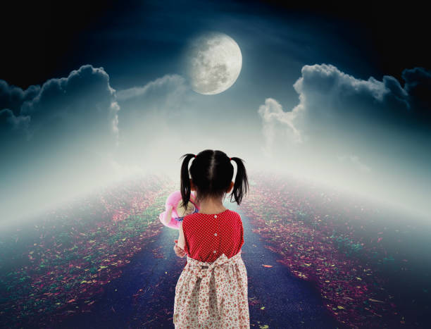 istock Lonely child with doll sad gesture on pathway with moon. 814236868