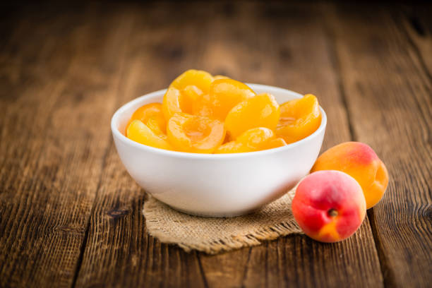 istock Pickled Apricots (selective focus) on vintage wooden background 814239482
