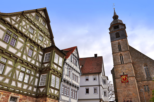 Old colored half-timbered houses and Evangelical church in market  square of Boblingen, Baden-Wurttemberg, Germany.