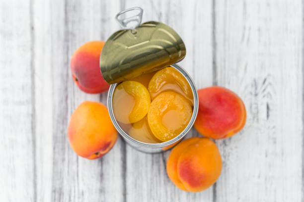 istock Preserved Apricots on wooden background (selective focus) 814242966
