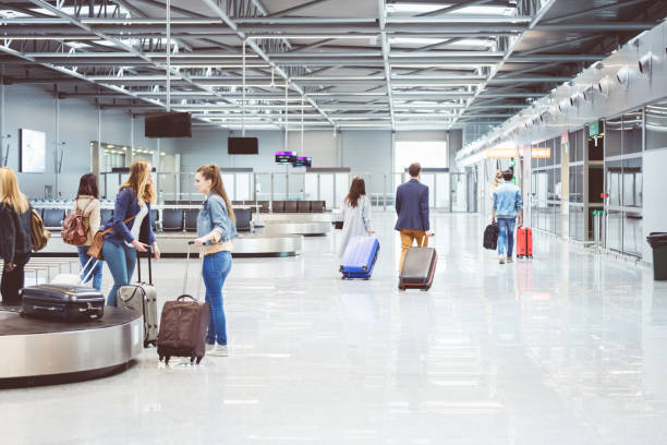 istock Passengers walking to board flight in airport 814271262