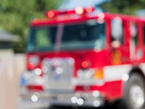 istock Fire Engine Cab Blurred Out of Focus Lights in Parade 814287746