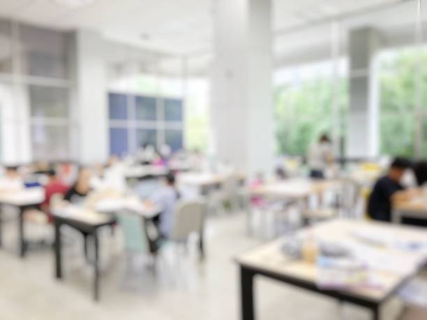 istock Education concept on blurred image background of student reading in modern library for relax education in university. Lifestyle knowledge and learning Concept. 814304276