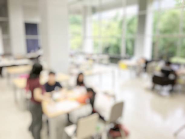 istock Education concept on blurred image background of student reading in modern library for relax education in university. Lifestyle knowledge and learning Concept. 814304334