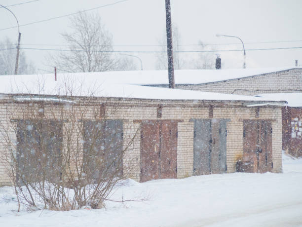 istock winter gate car garages made of brick 814307378