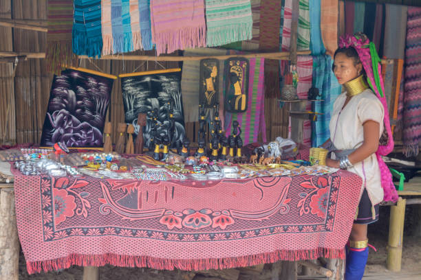 Long Neck Village in Thailand CHIANG MAI, THAILAND - July 10, 2017: Long Neck woman in a tribe near Chiang Mai in Northern Thailand. kayan neck rings stock pictures, royalty-free photos & images